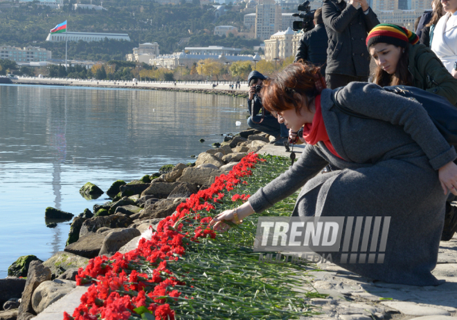 Baku residents bringing flowers to Seaside Boulevard to honor missing oil workers.  Azerbaijan, Dec.07, 2015